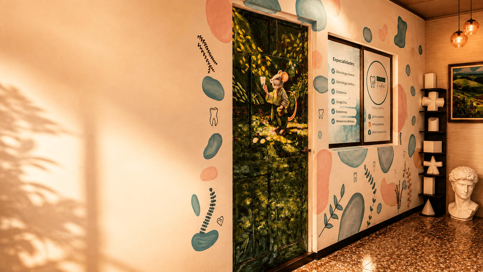 Recepción de Clínica Dental D'Arte: puerta con mural artístico, esculturas y busto estilo David